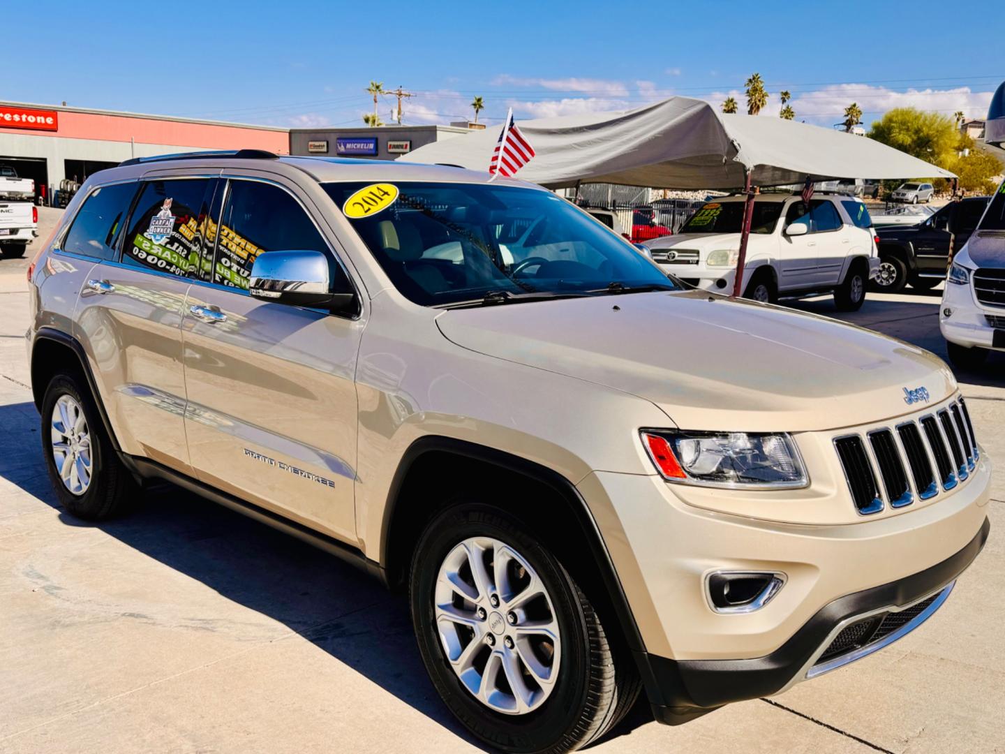 2014 gold Jeep Grand Cherokee Limited 2WD ( 1C4RJEBGXE) with an 3.6L V6 DOHC 24V engine, 5-Speed Automatic transmission, located at 2190 Hwy 95, Bullhead City, AZ, 86442, (928) 704-0060, 0.000000, 0.000000 - 2014 Jeep Grand Cherokee Limited. 2wd. only 89k miles *1owner. leather loaded, moonroof, michelin tires. Clean carfax. - Photo#0